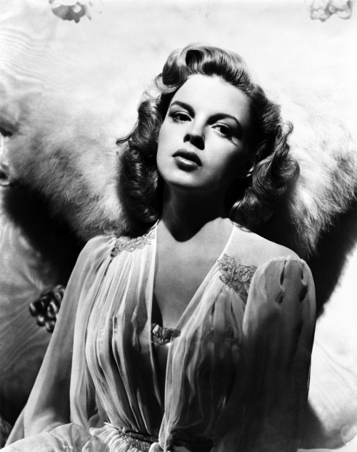 Thoughtful Judy Garland Leaning On Rug