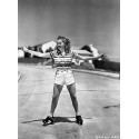 Smiling Betty Grable Skating on Street